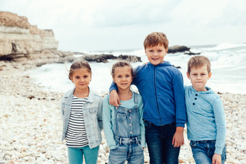 Fashion children on the sea shore