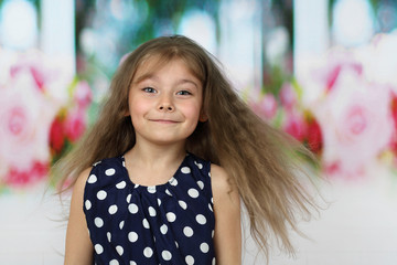 Pretty little girl with long flying hair