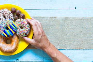 Colorful Donuts breakfast composition with different color styles