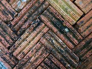 old and stained brown brick tiles