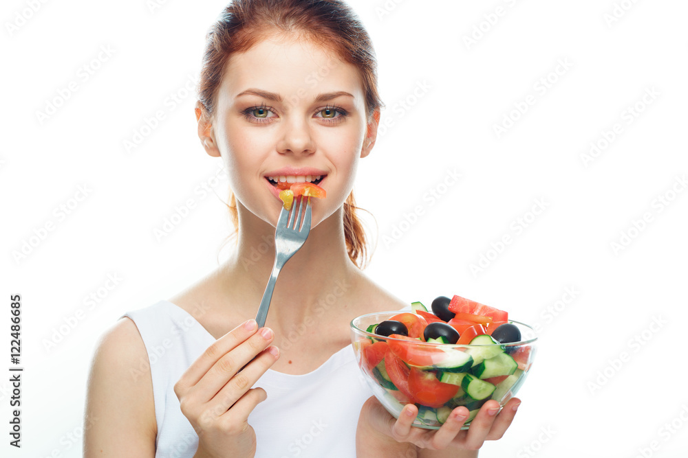 Wall mural beautiful woman eating a salad