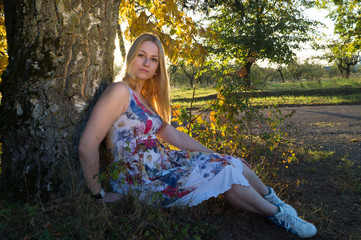 Beautiful woman in autumn park