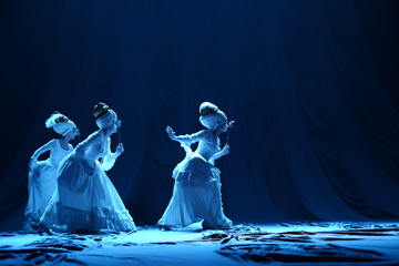 Three girls in vintage dresses actress on stage