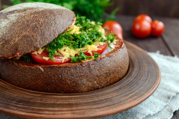 Original appetizer - stuffed rye bread, baked. Dish in rustic style