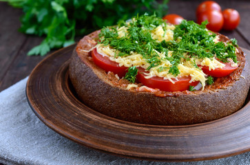 Original appetizer - stuffed rye bread, baked. Dish in rustic style