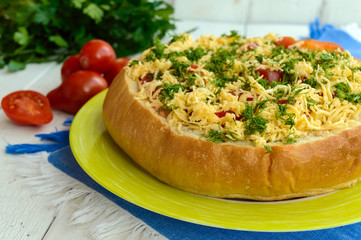Original appetizer - stuffed wheat bread is baked. Dish in a rustic style.