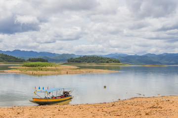 Naklejka na ściany i meble Boat at the Kaeng Krachan Dam in Kaeng Krachan National Park Thailand