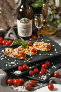 Bruschetta with smoked meat and cherry tomatoes