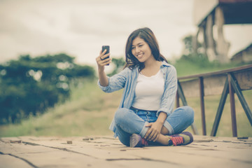 Fashionable Young Woman with her Mobile Phone.