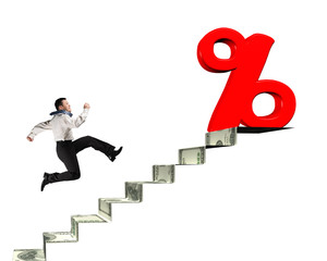 Man running toward percentage sign on top of money stairs
