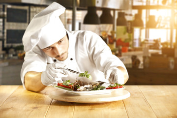 young cook and blurred background 