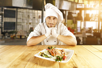 young cook and blurred background 