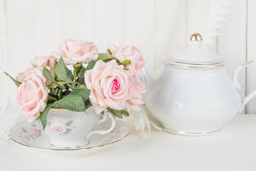 Tea cup, teapot and roses