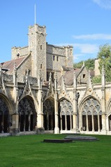 Fototapeta premium Cloisters of Canterbury Cathedral with Tower in background