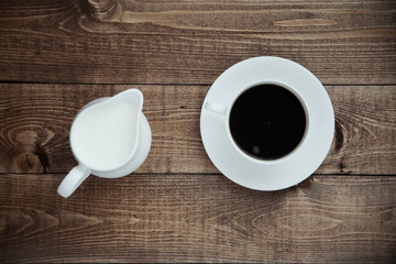 milk jug with a cup of coffee