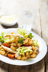 Grilled chicken and pasta salad with red pesto