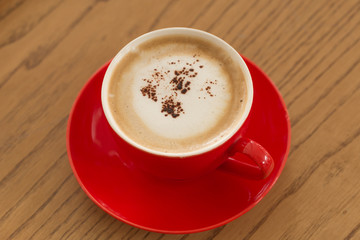 cup of fresh espresso on wood table