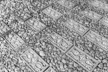 Fototapeta na wymiar Walkway surface made of gravel grainy , stone and bricks for bac