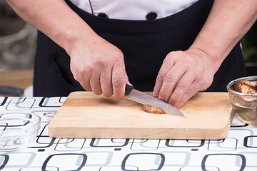 Chef is cutting mushroom