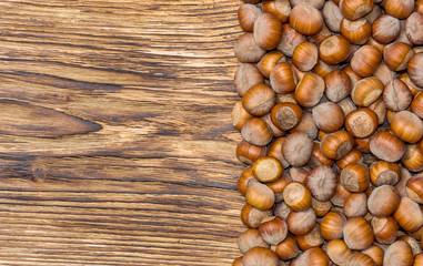 Hazelnuts on wooden background. Top view