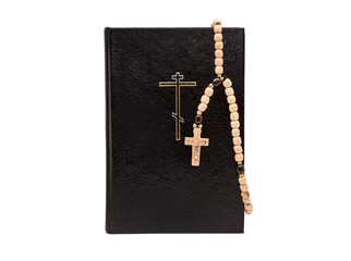 Bible with rosary beads isolated on white