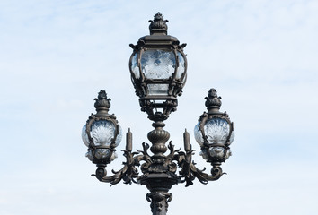 Fototapeta na wymiar Parisian lamppost closeup against clear sky