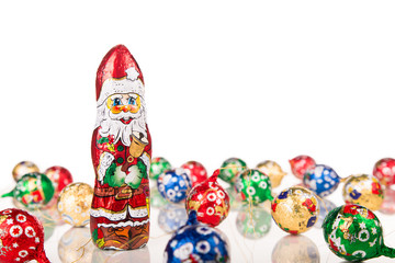 Fototapeta na wymiar Santa Claus chocolate figure with xmas decoration