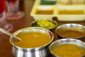 Indian yellow curry meal on table
