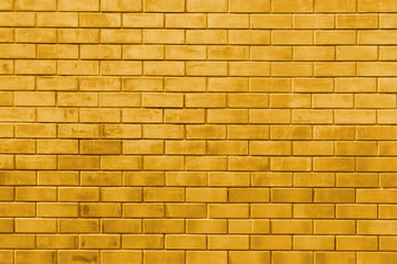 Yellow gold brick wall abstract texture background