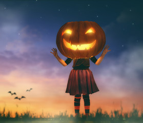 kid with a big pumpkin head