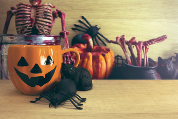 halloween coffee cup with spider and cat and horror decor prop background