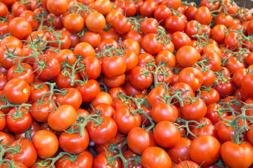 cherry tomatoes on market ,background texture