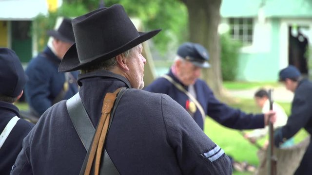 Civil War soldiers setting up camp