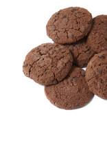A pile of chocolate chunk cookies isolated on a white background forming a page border