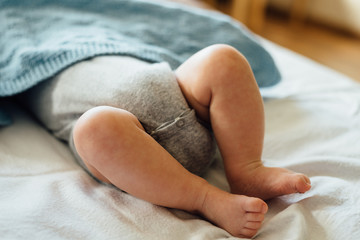 Baby holding his legs
