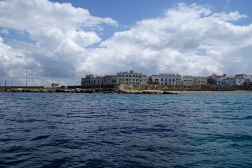 Fototapeta premium Old town, boats sea and sky by a speedboat