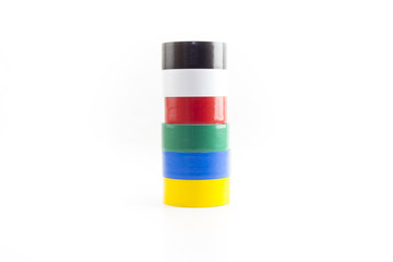 Multicolored adhesive insulating tapes roll isolated on white background.