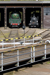 Old Vintage Steam Locomotives At The Train Depot

