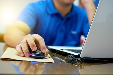 Fototapeta premium Hand office man on mouse working with computers.
