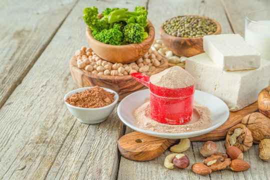 Selection vegan protein sources on wood background