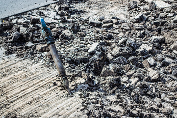 a jackhammer in the middle of the road
