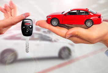 Dealer hand with a car key.