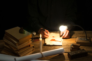 Man writing a letter with quill and sealing. Vintage © inventart