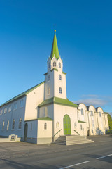Fototapeta na wymiar The Free Church in Reykjavik downtown at sunset