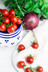 Fototapeta na wymiar Cherry tomatoes in a barrel, selective focus, top view, vertical