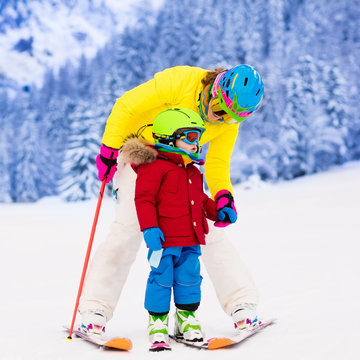 Mother and little boy learning to ski