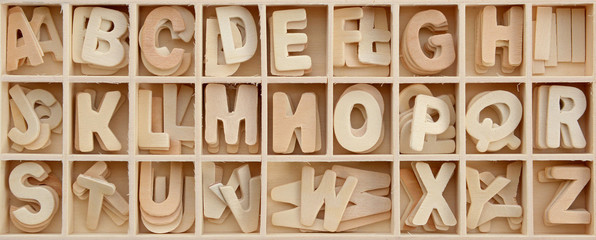 Capital wooden block letter ABC alphabet set in a wood box