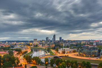 Aerial panoramic cityscape with skyscrapers of New Center of Vilnius from Gediminas Tower in the cloudy evening, Lithuania, Baltic states.