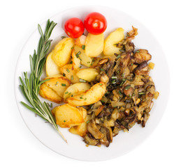 Dish with fried potatoes and cepes isolated on a white backgroun