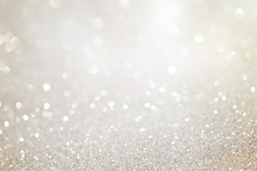Silver glittering christmas lights. Blurred abstract holiday background